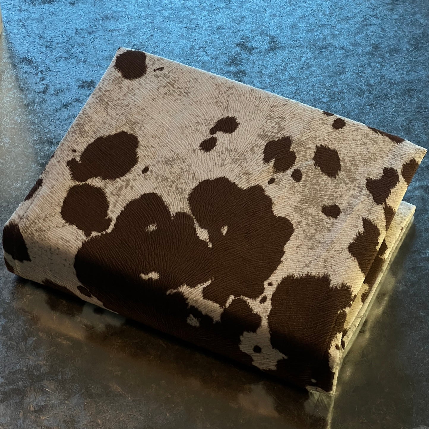 REDEEMED BARE BLACK COW PRINT BIBLE COVER